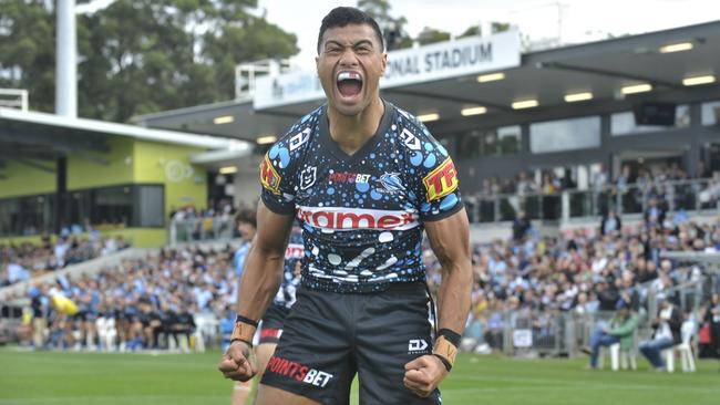 Cronulla Sharks winger Ronaldo Mulitalo celebrates a try against the Gold Coast Titans. Photo: Tim Jarrett