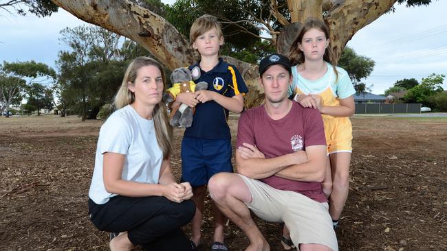 Angry residents Tiffany and Evan Bradley with kids Cole, 7 and Aylish, 10 at Helmsman Terrace Park. Picture: Michael Marschall