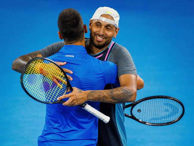 Australiaâs Nick Kyrgios (R) and Serbiaâs Novak Djokovic (L) celebrate their victory following their menâs doubles match against Austraiaâs Alexander Erler and Germanyâs Andreas Mies at the Brisbane International tennis tournament in Brisbane on December 30, 2024. (Photo by Patrick HAMILTON / AFP) / -- IMAGE RESTRICTED TO EDITORIAL USE - STRICTLY NO COMMERCIAL USE --