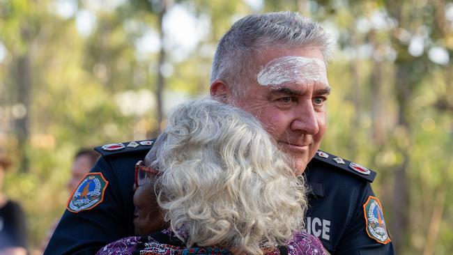 NT Police Commissioner Michael Murphy, embracing Djalinda Ulamari, delivered an apology to First Nations people at Garma. Picture: Nina Franova/YYF