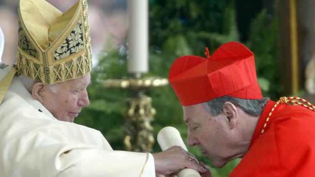 Newly appointed cardinal George Pell kisses Pope John Paul II's hand on St Peter’s Square at the Vatican during the ordination ceremony of new cardinals. Picture: AFP.