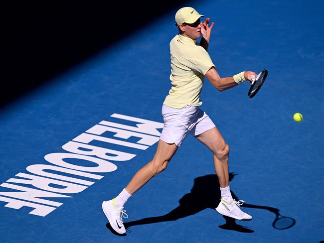 Jannik Sinner of Italy hits a return during the match against Popyrin. Picture: William West / AFP