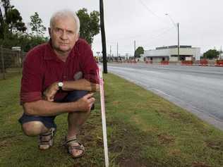 Neil Riethmuller lives opposite the McDonalds development on the corner of Davis St and Anzac Av (between James and Tor Sts) and will loose some of his footpath in the road widening process. . Picture: Kevin Farmer