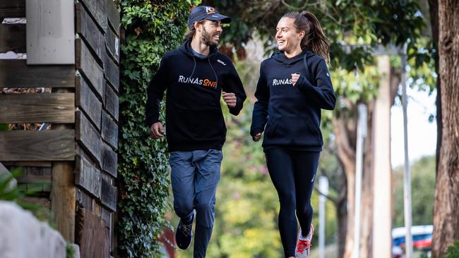 Olympian Izzi Batt-Doyle and elite runner Riley Cocks running near the Runhouse cafe they own. Picture: Tom Huntley