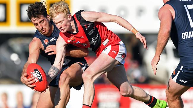 South's Adelaide's Nic Schwarz and West's John Noble compete for the ball. Picture: Tom Huntley