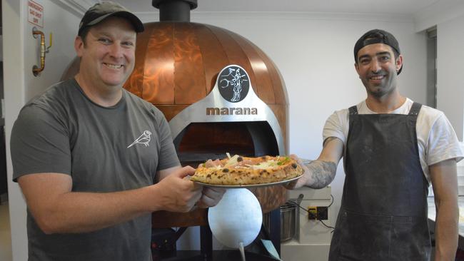 SLICE OF LIFE: Standing with the finished product are The Finch co-owner Dan and pizza chef Mattia Montis. Picture: Rhylea Millar