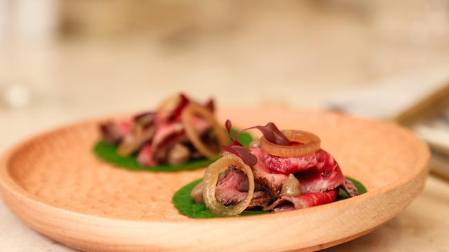 Seared Beef, onion ,sesame leaf and black garlic snack as Kōst opens on the Gold Coast this weekend. Picture: Glenn Campbell