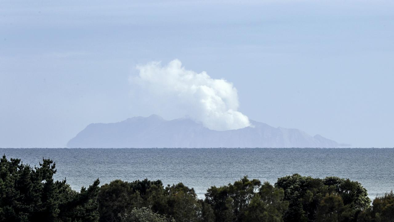 Plumes of steam rise above White Island off the coast of Whakatane. Picture: AP/Mark Baker