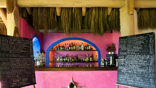 Menu boards and bar at the restaurant at Playa Rosa, Careyes.