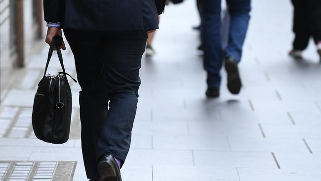 SYDNEY, AUSTRALIA - NCA NewsWire Photos NOVEMBER, 19, 2020: An office worker seen in the central business district in Sydney. Picture: NCA NewsWire/Joel Carrett