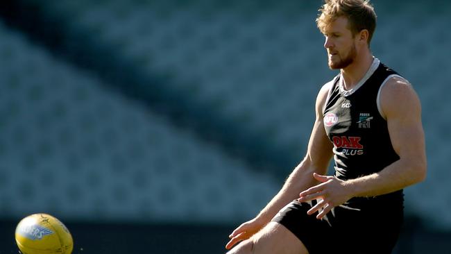 Tom Jonas trains at Adelaide Oval last week just before hurting his calf. Picture: Kelly Barnes (AAP).