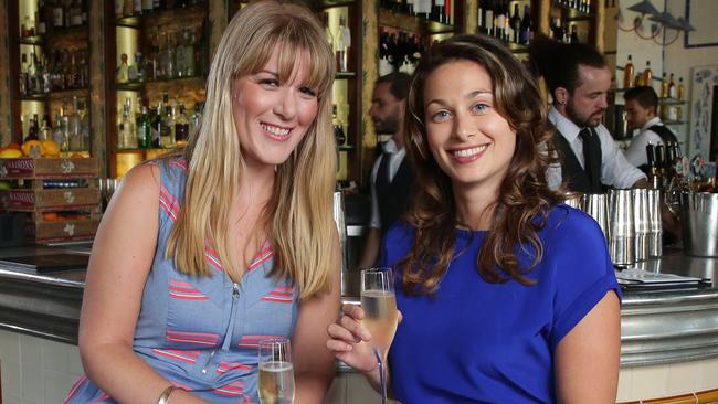 Sarah Davis, right, is a wellness and relationship coach, who believes she knows why women are single, despite wanting a partner. Pictured at Ananas in The Rocks. Picture: Adam Ward.