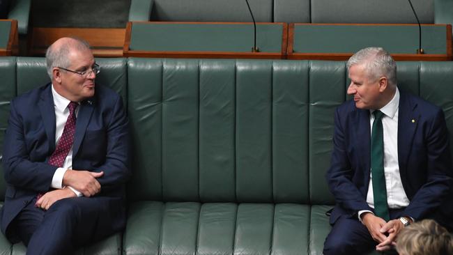 Prime Minister Scott Morrison and Deputy Prime Minister Michael McCormack practise social distancing in the House of Representatives.