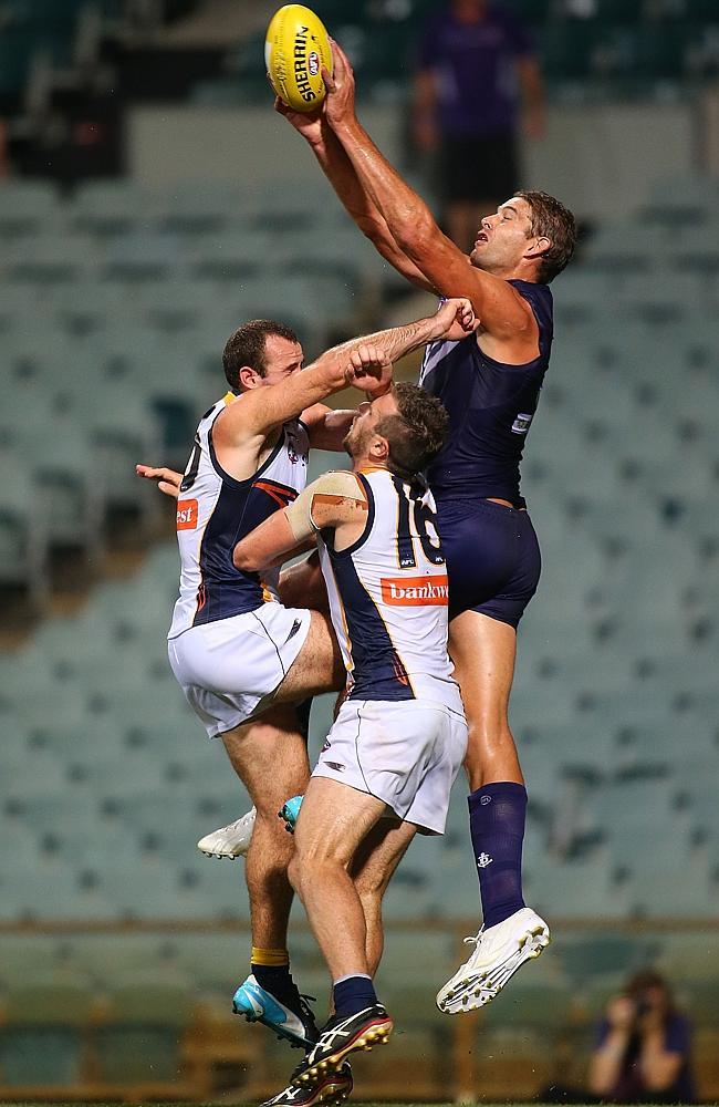 Fremantle ruckman Aaron Sandilands contests against Eagles Shannon Hurn and Eric Mackenzie. Picture: Getty