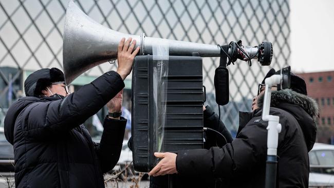 Protesters against impeached South Korean president Yoon Suk Yeol set up a loudspeaker on the opposite side of the road from the rally site of the president's supporters in Seoul on Monday. Picture: AFP