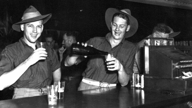 Australian soldiers enjoying a beer in Darwin in 1945. Picture: State Library of Victoria