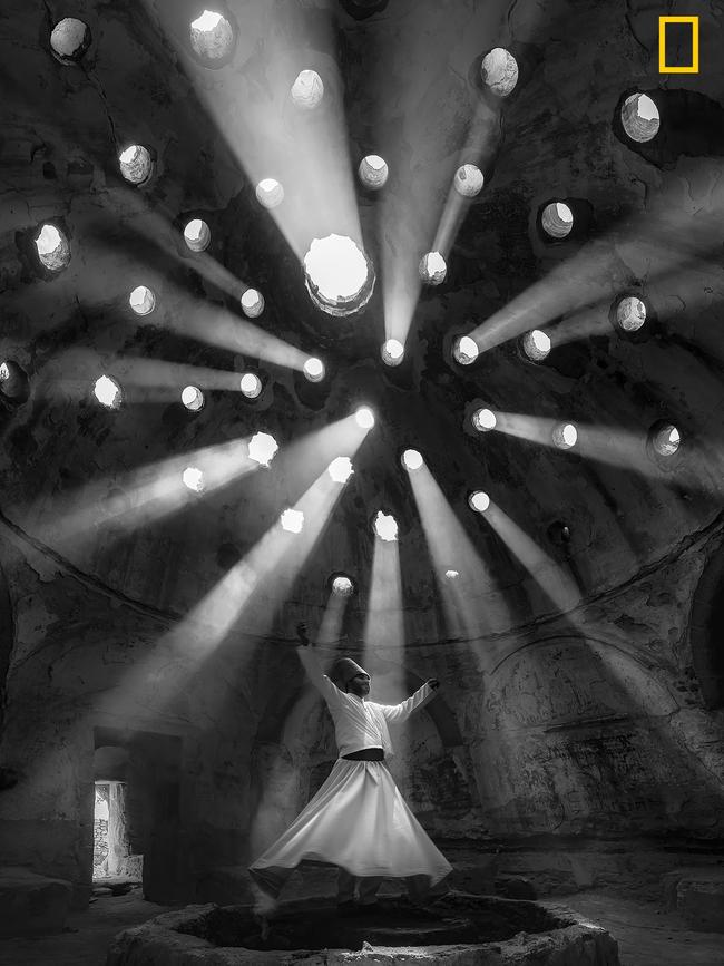 Worship This photo was taken in Konya. Willing Dervish in an historical place of Sille KonyaTurkey. The dance of the Whirling Dervishes is called Sema and is a symbol of the Mevlevi culture. According to Mevlana teachings, human beings are born twice, once of their mothers and the second time of their own bodies. Picture: F. Dilek Uyar / National Geographic Travel Photographer of the Year