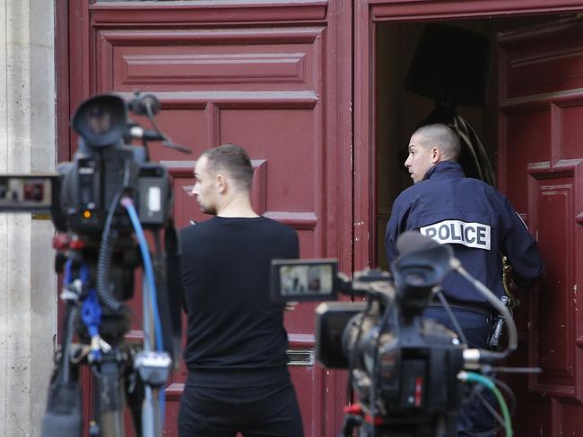 A French police officer enters the residence of Kim Kardashian in Paris. Picture: AP Photo/Michel Euler