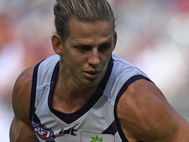 Nat Fyfe of the Dockers is seen in action during the Round 4 AFL match between the Melbourne Demons and Fremantle Dockers at the MCG in Melbourne, Saturday, April 15, 2017. (AAP Image/Julian Smith) NO ARCHIVING, EDITORIAL USE ONLY