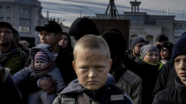 In a crowded square, the crowd falls silent as President Zelensky delivers a speech after the liberation of Kherson, Ukraine. Glib, a 13-year-old boy, listens attentively in the front row: for the first time since the beginning of the war, he can finally leave his house. Picture: Andras D. Hajdu