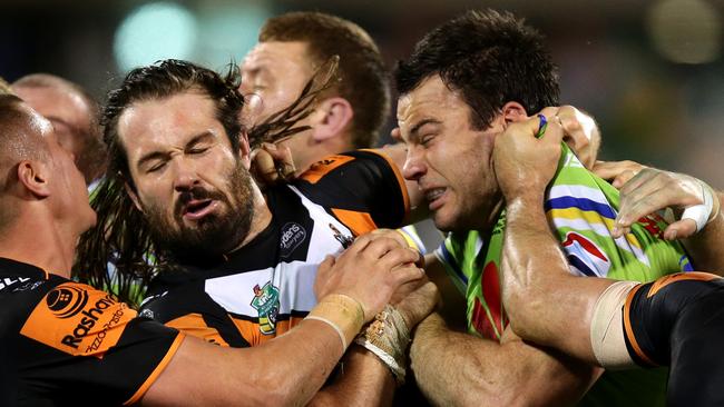 Raiders David Shillington headbutts Tigers Aaron Woods and gets sent from the field by Refere Jared Maxwell during the NRL game between the Canberra Raiders and the Wests Tigers at GIO Stadium,Canberra .Picture Gregg Porteous