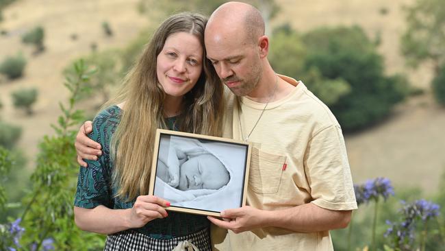 John and Eleanor Day with a picture of son Quincy Lazarus, who died hours after birth. Picture: Keryn Stevens