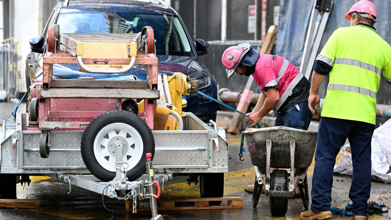 Sub-contractors and tradesmen pack up their equipment and walk off the 443 Queens Street construction site in Brisbane after giant Probuild collapsed. Picture: Dan Peled/NCA NewsWire