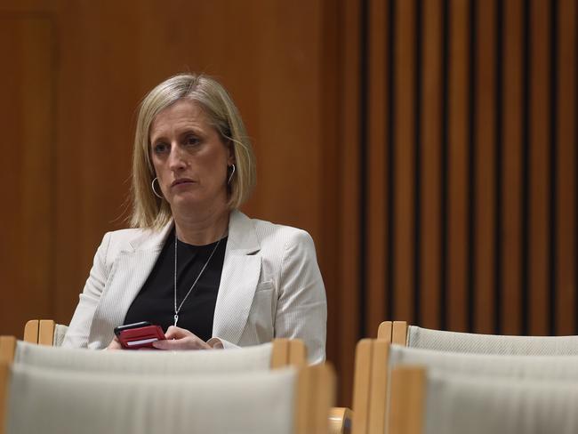 **FILE** An October 6, 2016 file photo of Senator Katy Gallagher listens during the House of Representatives Standing Committee on Economics annual public hearing at Parliament House in Canberra. Labor frontbencher Katy Gallagher could be referred to the High Court after revealing British authorities did not confirm renunciation of her UK ties until two months after nominations closed for the 2016 election. (AAP Image/Lukas Coch) NO ARCHIVING