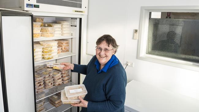 Tony's Community Kitchen director Alison Hunter loads meals into a fridge at the new James Street facility. Picture: Kevin Farmer