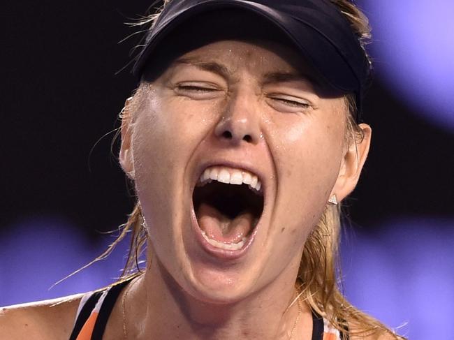 TOPSHOT - Russia's Maria Sharapova shouts during her women's singles match against Switzerland's Belinda Bencic on day seven of the 2016 Australian Open tennis tournament in Melbourne on January 24, 2016. AFP PHOTO / PETER PARKS-- IMAGE RESTRICTED TO EDITORIAL USE - STRICTLY NO COMMERCIAL USE / AFP / PETER PARKS