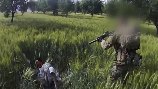 A screenshot from footage aired by the ABC’s Four Corners program showing the alleged execution of an Afghan by a special forces soldier in Afghanistan. Picture: Four Corners