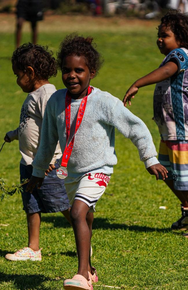 Melbourne Demons players Shane McAdam and Andy Moniz-Wakefield went to Santa Teresa ahead of the 2025 AFL game in Alice Springs. Picture: Melbourne Demons