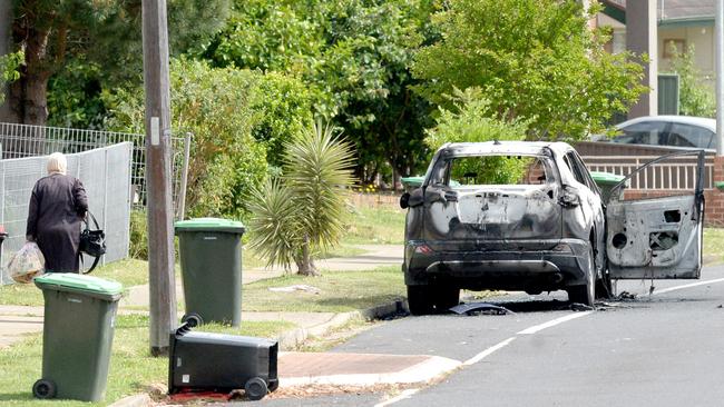 A burnt out car believed to be involved in the shooting at Condell Park. Picture: Jeremy Piper