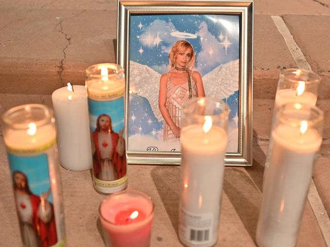 Candles are placed around a photo of cinematographer Halyna Hutchins who was killed on set while filming the movie Rust at Bonanza Creek Ranch near Santa Fe, New Mexico. Picture: Getty Images