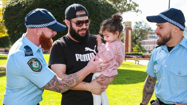 Senior Constable Heginbotham and Senior Constable Victor Suarez, with Heman Shrief and his daughter Destiny. Picture:Justin Lloyd.