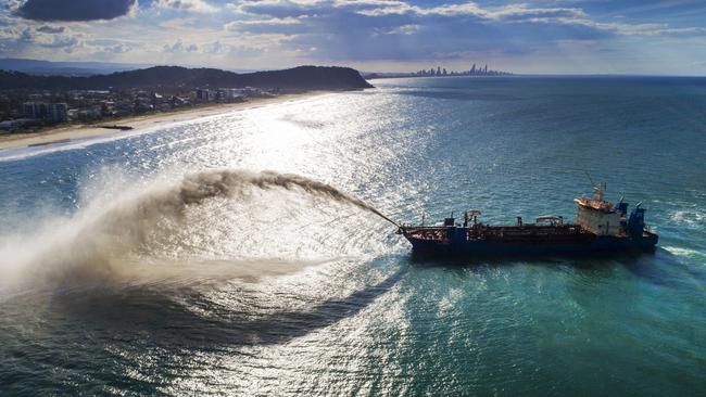 The 111 meter dredge replenishing sand in action at Palm Beach, Gold Coast. Picture: NIGEL HALLETT.