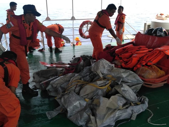 Recovery crews work at the crash site of Lion Air flight JT610.