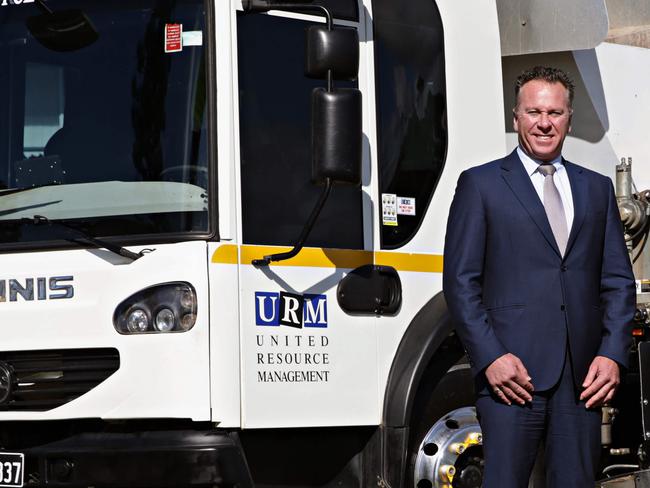 Anthony Johnston from URM with one of his garbage trucks. Picture: Adam Yip / Manly Daily