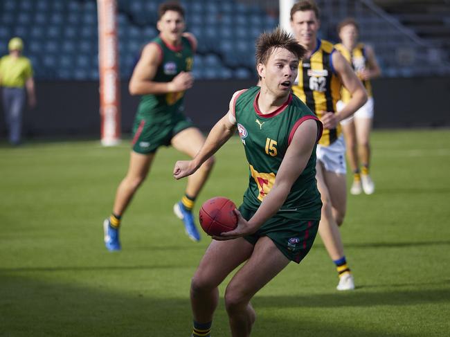 Tasmania's Baxter Norton looks to hand ball during Sunday's clash with Sandringham. Picture: Rod Thompson