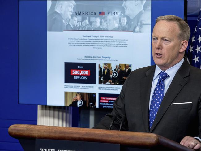 White House spokesman Sean Spicer stands in front of the newly launched website celebrating Donald Trump’s first 100 days. Picture: AP Photo/Andrew Harnik