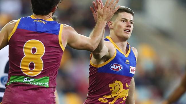 Dayne Zorko of the Lions celebrates a goal.