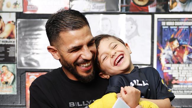 The Daily Telegraph 4.12..2024 Former world champion boxer Billy Dib has written a book, Boys Do Cry, encouraging young males to express their emotions. Pictured with his son Laith Dib, 5, in his Narwee home gym. Picture: Rohan Kelly.