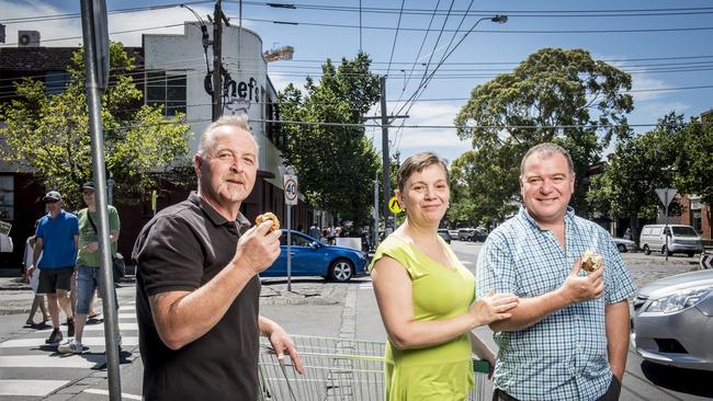 Years later, the same siblings enjoy hot jam doughnuts together. Picture: South Melbourne Market