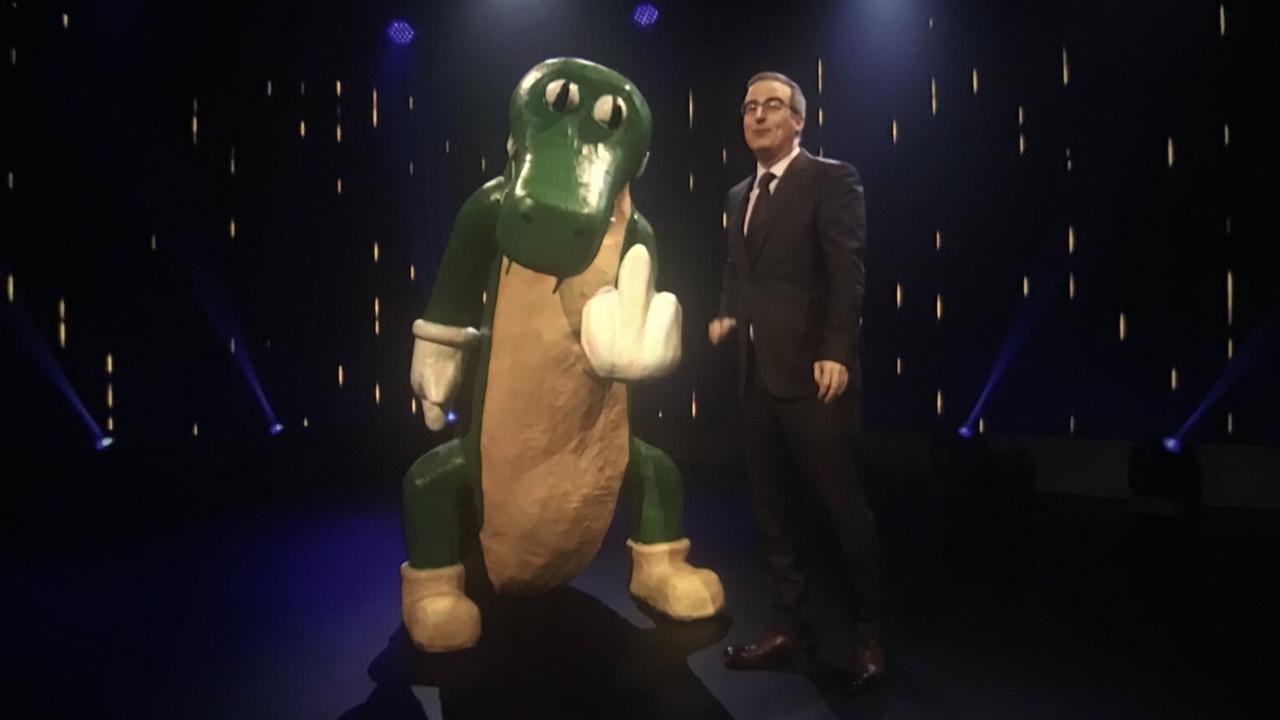 John Oliver with his alligator statue giving the finger. Picture: @gpirnia / Last Week Tonight with John Oliver