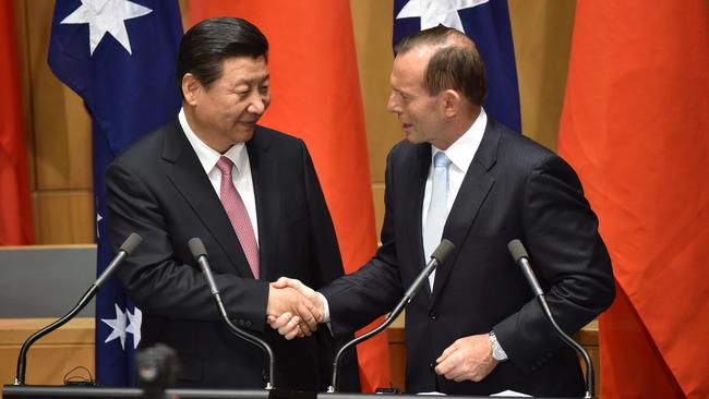 China President Xi Jinping shakes hands with then prime minister Tony Abbott during a visit to Australia in 2014. Picture: Mark Graham