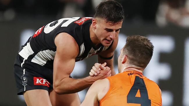 Daicos consoled GWS captain Toby Greene immediately after the preliminary final siren at the MCG on Friday night. Picture: Michael Klein