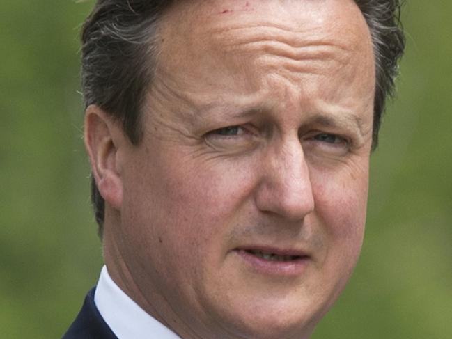 Britain's Prime Minister David Cameron is seen walking at the G7 Summit at the Schloss Elmau castle resort near Garmisch-Partenkirchen, in southern Germany on June 8, 2015. AFP PHOTO/MANDEL NGAN