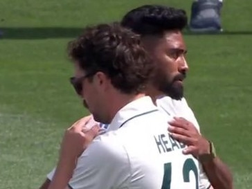 Travis Head and Mohammed Siraj embrace