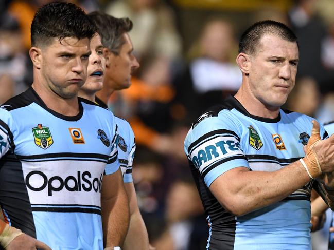 (l to R) Chad Townsend, Paul Gallen and Andrew Fifita of the Sharks look on following a try scored by Kevin Naiqama of the Tigers during the round 9 NRL match between the West Tigers and the Cronulla Sutherland Sharks at Leichhardt Oval in Sydney on Saturday, April 29, 2017. (AAP Image/Paul Miller) NO ARCHIVING, EDITORIAL USE ONLY