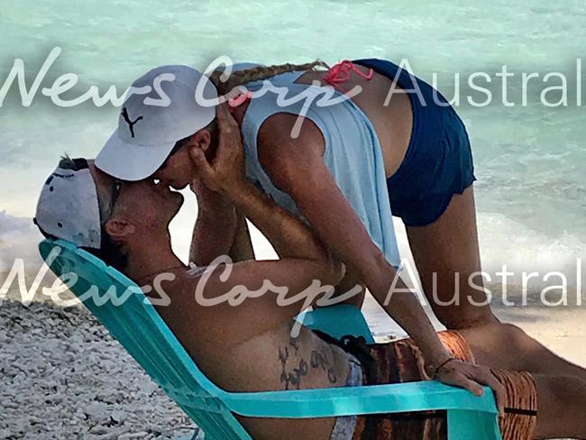 John and Yvette Nikolic kissing on Rangiroa, one of the Tuamotus Islands in French Polynesia. Picture: Jeff Hassell.